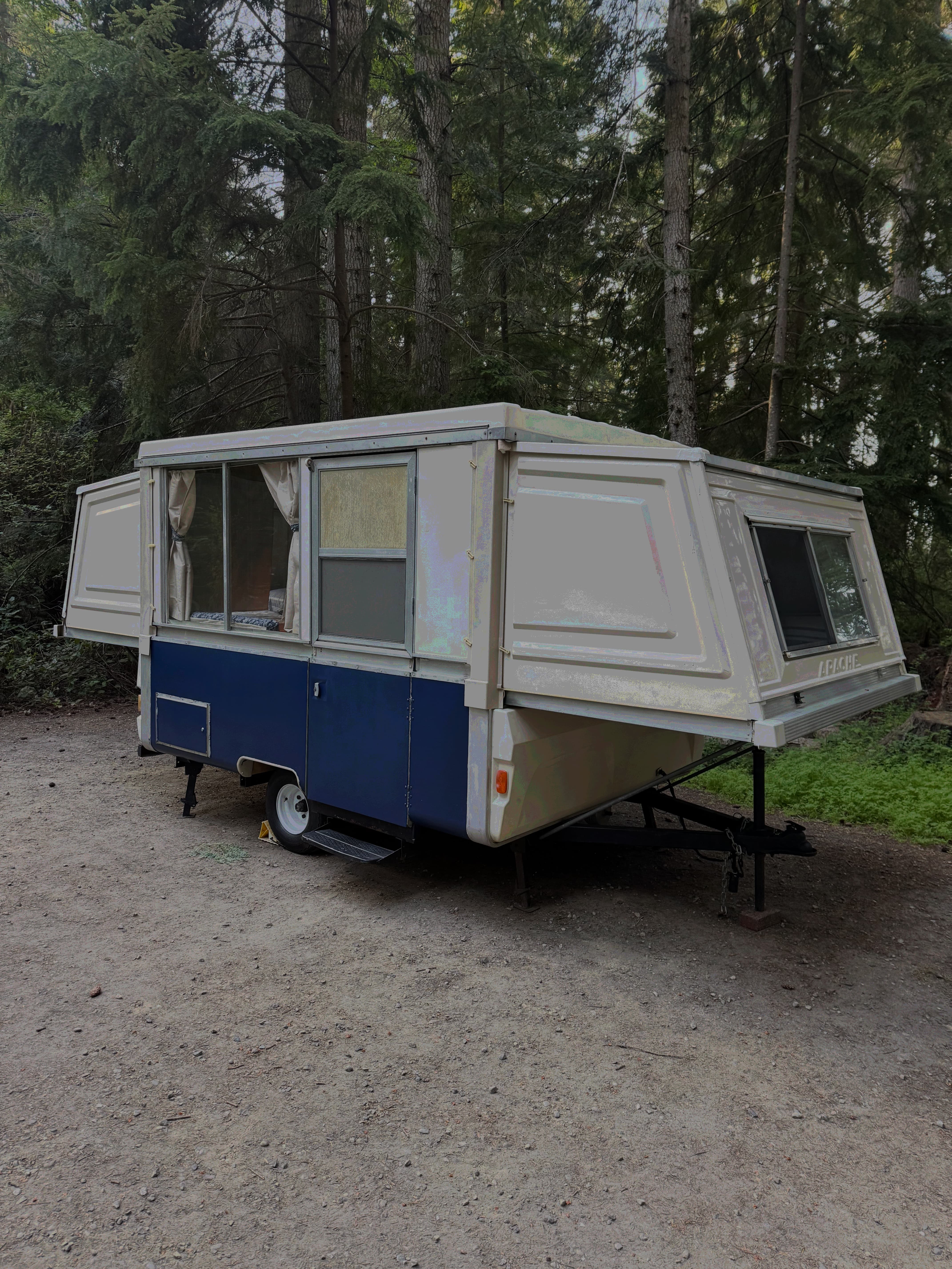 1977 Apache Mesa trailer exterior in forest