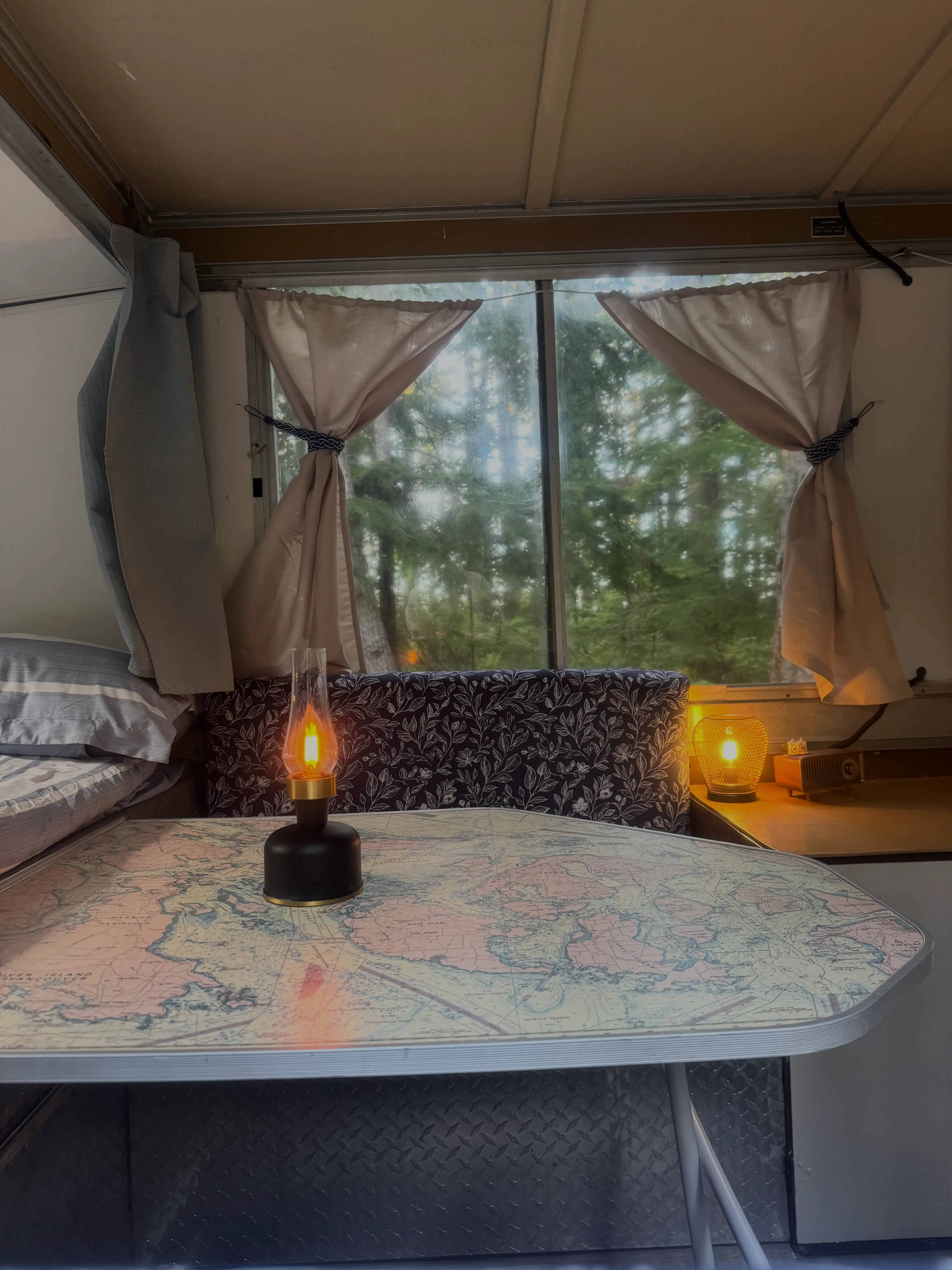 Cozy interior with map table and lanterns